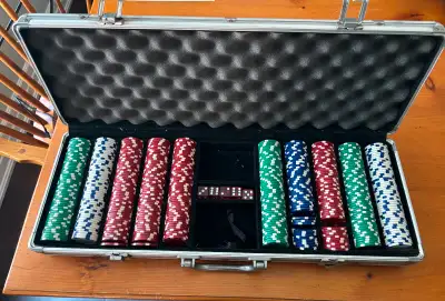 This is a large set of poker chips. The chips weigh 12 grams each. There are also 5 dice. There are...