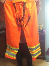 Bib style orange level 2 safety wear pants.