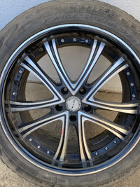 4 RTX rims with tires on them