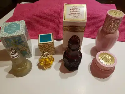 Set of five Avon bottles from the early 1970's, some with quite a bit of the perfume still inside, s...