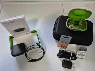 Phonak Hearing Aids Model #B50, in excellent condition, used intermittently. Comes with case and TV...