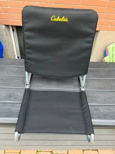 2 practically new Cabela’s camping cots with side accessories pouch for each cot. Also a Cabela’s co...