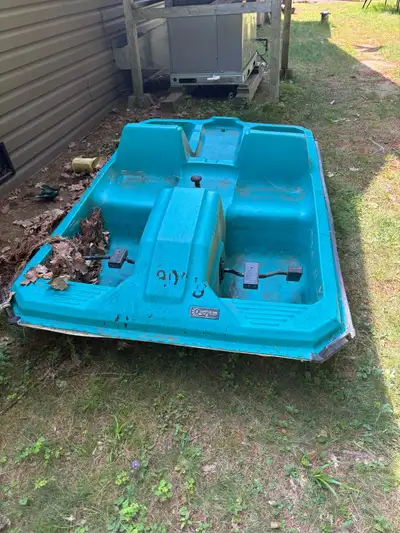 Blue pedal boat for sale. Works well. Floats, rudder works, paddles turn. Missing trim piece at fron...