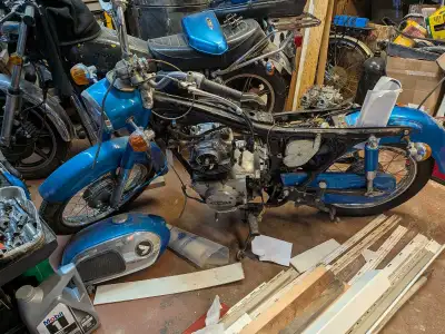 Everything is there other than the left-hand mirror and a proper battery strap. It runs and drives ,...