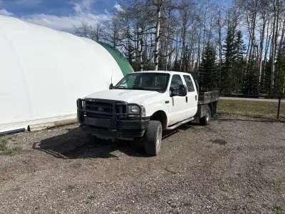 Ford 350 7.3 diesel 8' flatbed Rebuilt status Runs great has gooseneck hitch Carfax is available maj...