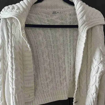 Thick knitted comfy white collared sweater with jeweled buttons. Can fit small or medium size for an...