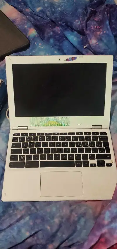 This is an Acer Chromebook, perfect for on-the-go use! It is in used condition, and shows some signs...