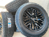 A81. 2023 Chevy Silverado\Tahoe black rims Cooper AT3 tires