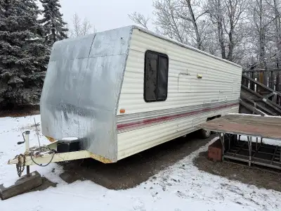 25 foot work trailer with heavy duty storage shelves, workbench and ramp. Electric brakes, trailer l...