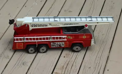 This listing is for a vintage red Tonka Fire Truck. It is a metal toy and it is very large, around 2...