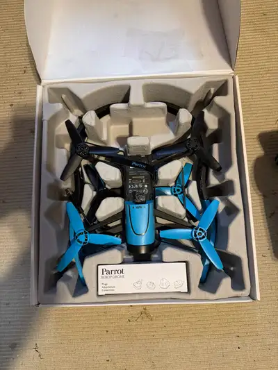 Capture stunning aerial views with this Parrot Bebop Drone, featuring a 14-megapixel camera with 3-a...