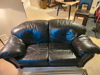 Genuine leather loveseat . Zippered cushions and Velcro fixation. $6,000 new