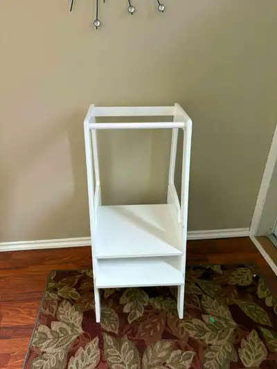 A standing step stool for toddlers to help- in the kitchen, brush their teeth. Does not adjust