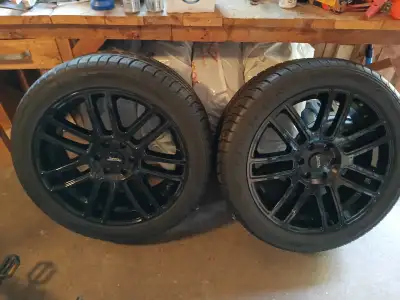 2 22-inch American Racing rims with a new set of GoodYears. Ripped the plastic off the tires and nev...