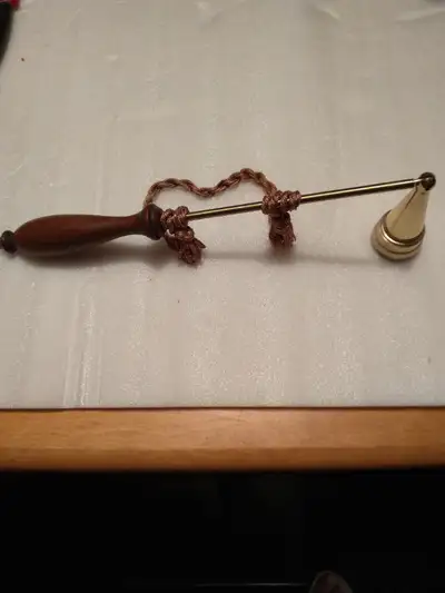 10" vintage brass candle snuffer w/wood handle., View more