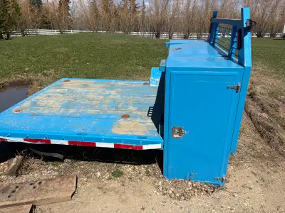 Used aluminum Flat deck Made for a single wheel Longbox unit is in great shape has nice side cabinet...
