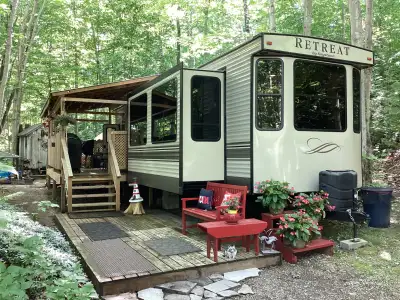 A Well kept beautiful couples trailer that can sleep 4. It has a full size fridge, central Vac, RV k...