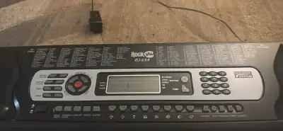 Selling a used Rockjam RJ-654 keyboard featuring 61 keys, a built-in speaker system, and various ins...