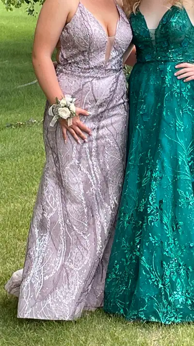Grad dress from 2023. Size 10. Paid $850. Mauve with assorted embroidery. Good condition. Message fo...