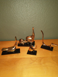 Set of 4 brass animals on black bases.