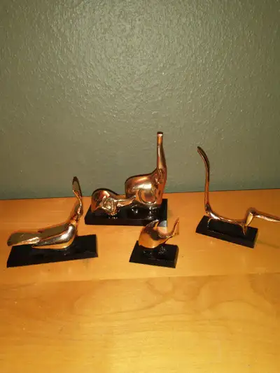 Set of 4 brass animals on black bases., View more