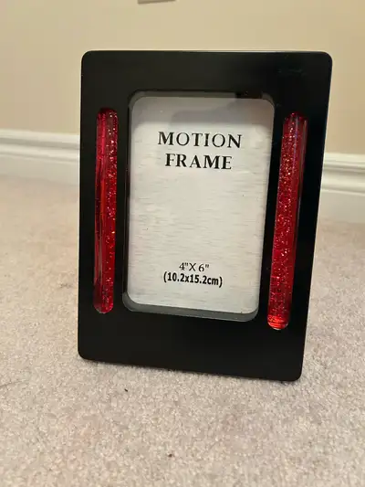 Glitter motion picture frame. Lights up with AC adapter (not included) Pick up Stouffville/Markham
