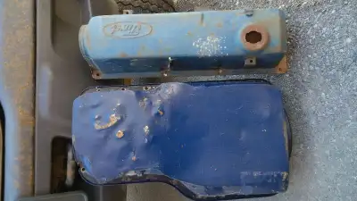 Dirty from storage. Oil pan custom fabricated to fit boat belly pan. Both parts for $25.