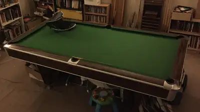 Get ready to rack 'em up with this used pool table * 12x6 * Green felt * Wood grain finish * Comes w...