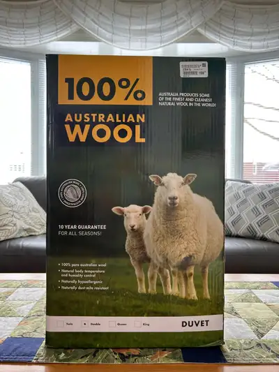Australian wool duvet; never used; bought for $160; box says double size but it is queen size