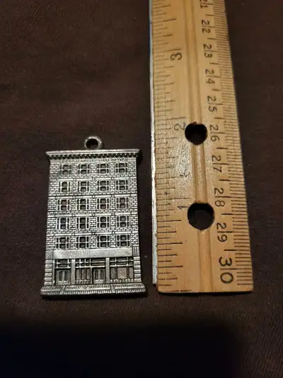 This vintage Leeson and Lineham Block Calgary, AB building pendant is a unique collectible! It's in...