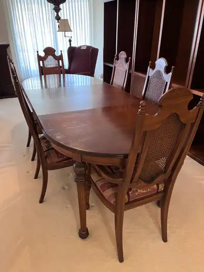Solid wood dining table and six matching chairs, $950, View more