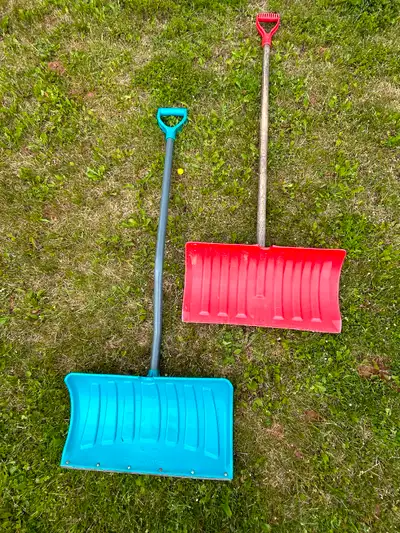 2 snow shovels, one with 4’ metal handle, one with 4’ wood handle.