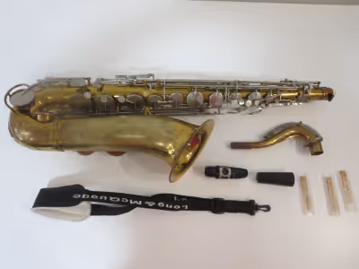 Bb TENOR SAXOPHONE, Made by King in USA. Model Cleveland. Few very minor dings. With some lacquer we...