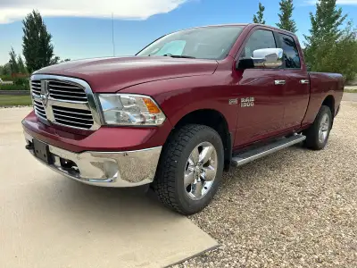 Quad Cab, 4X4 auto, 6’4” box, 2” Lift, 5.7 L Hemi, 8 speed transmission, back up camera, 8.4” touch...