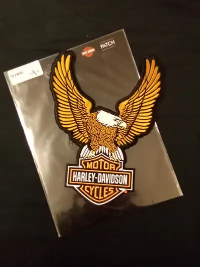 7 3/4" at its widest and 10" tall In package - was $39.99 new Photo color is not great - Eagle is go...