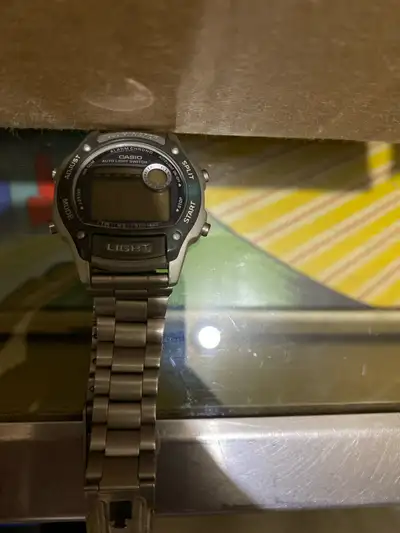 Selling a pre-owned Casio digital watch with a stainless steel band, perfect for everyday wear. This...