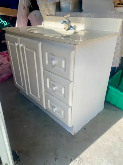 White vanity and countertop ,sink and faucet 36”wide 22” depth in good condition Asking $275