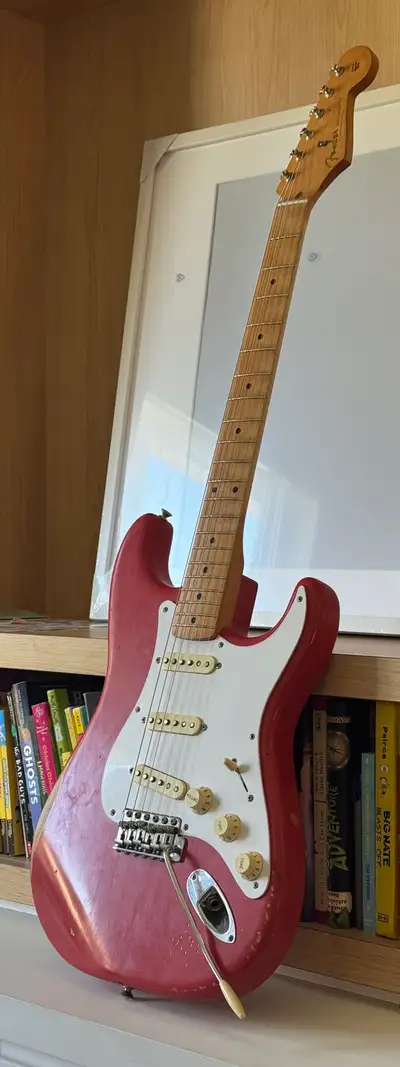 This April 2021 Fender Vintera Road Worn '50s Stratocaster in Fiesta Red (75th Anniversary) features...