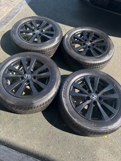 4 16 inch aluminum Honda wheels refinished in black with like new tires 205/55/16 both in like new c...