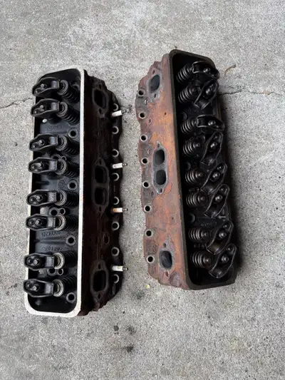These 906 heads have hairline cracks, typical of high mileage engines. These are sold as parts only....