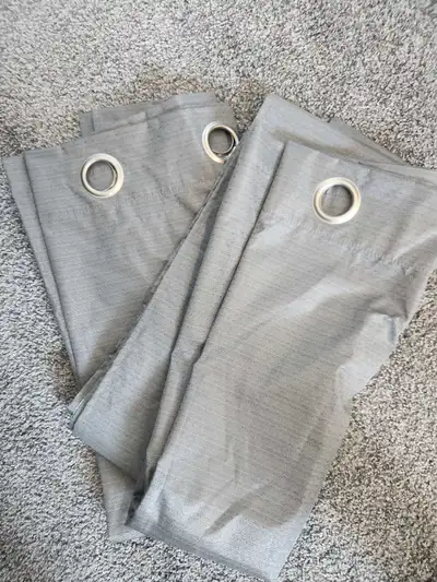 Two light grey curtain Panels: Additional details: * Brand: Mainstays * Dimensions: 40 in x 84 in /...