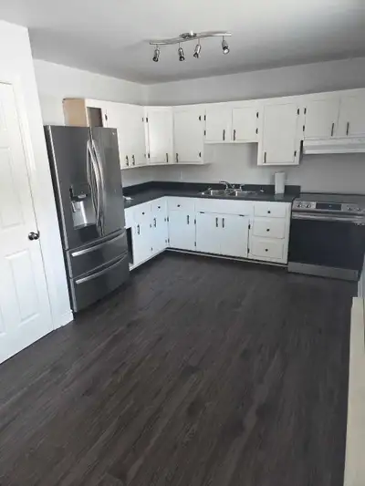 Tenants pay power. Snow removal, lawn care and hot water included in rent.