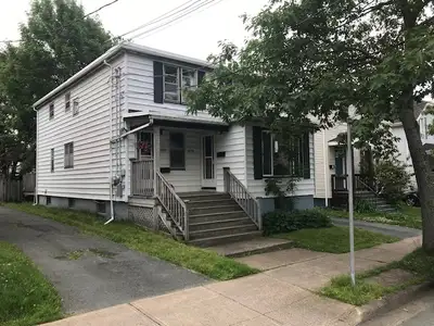 Bright, top floor flat in two-story house in central Halifax has large eat-in kitchen, 2 bdrms + DR....