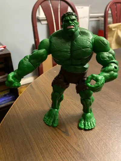 Behold, the mighty Marvel Legends Hulk action figure, a verdant goliath ready to smash into your col...