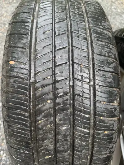 I am selling a set of used tires and rims with the specification 235/55R17 99V, suitable for all-sea...