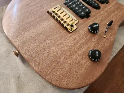 For Sale or Trade Charvel Pro-Mod DK24 HSH 2PT CM Mahogany Guitar features a Mahogany body, Carameli...