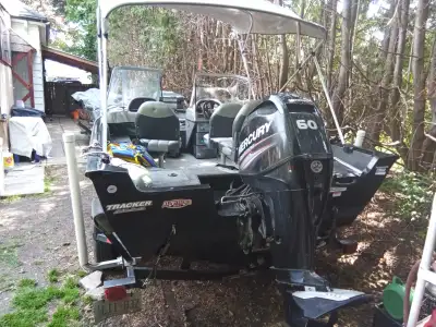 Silver and Black in color with 60HP Mercury 4 Stroke, and Minn kota trolling motor. Lowrance Hook Re...