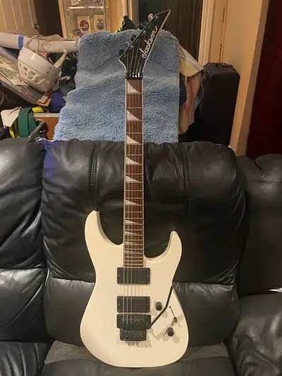 Jackson SLX Soloist in Snow White. Neck thru body design, very sturdy. Has EMG 60 & 89 pickups, the...
