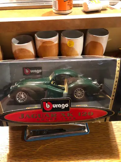 Vintage Burago-.Jaguar XK 120 die cast—- ( VIP Collection )—-New in box- asking 25.00. cant find a d...