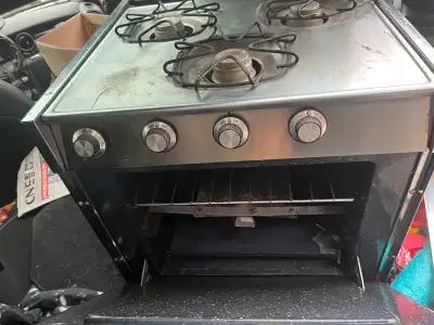 3 burner RV stove. Comes with a built-in oven. Worked perfectly when it was removed from the trailer...